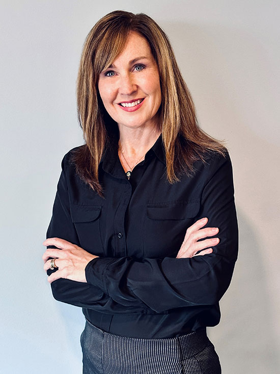 Wendy Burpee Headshot wearing dress shirt and smiling.